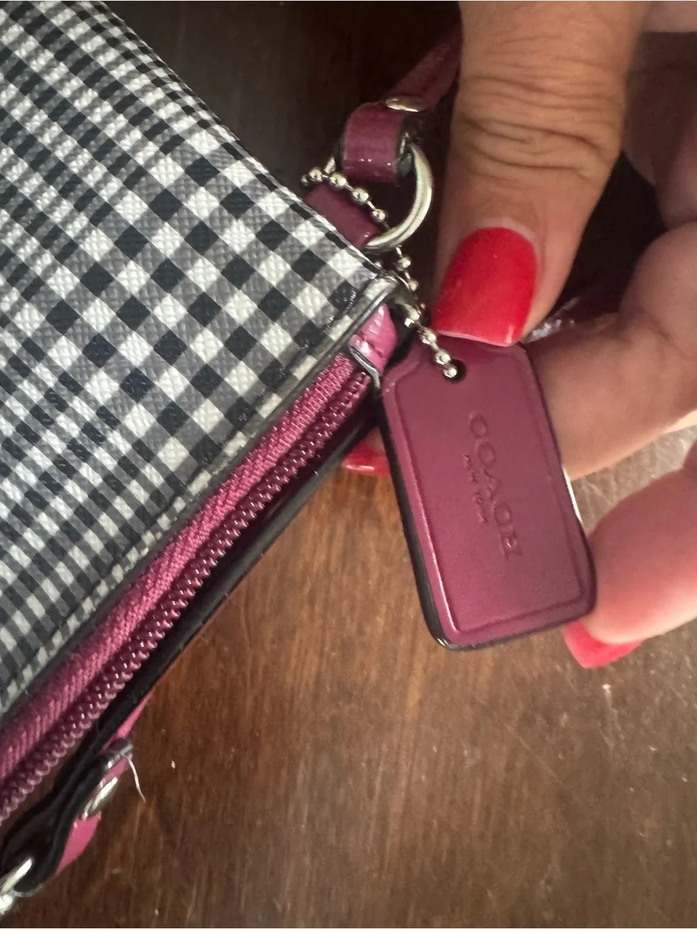 Coach Black-and-White Gingham Wristlet with Pink Logo